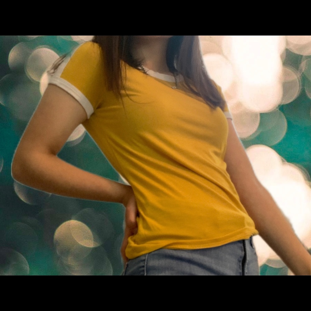 a mustard yellow shirt